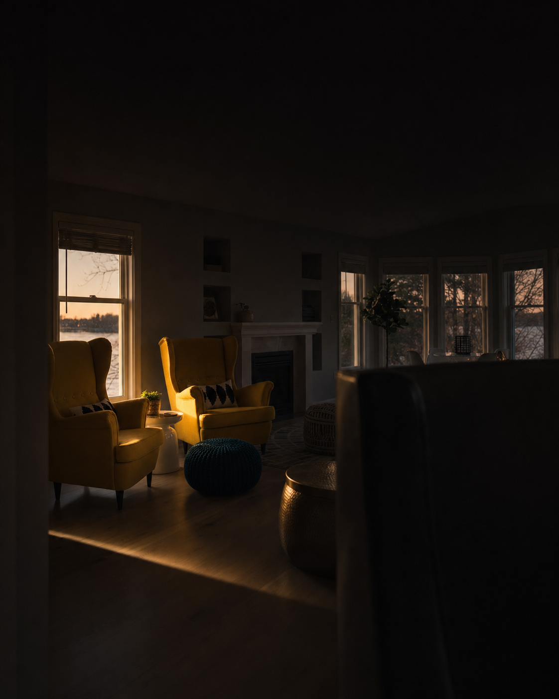 Marigold wingback chairs at dusk, catching the last light